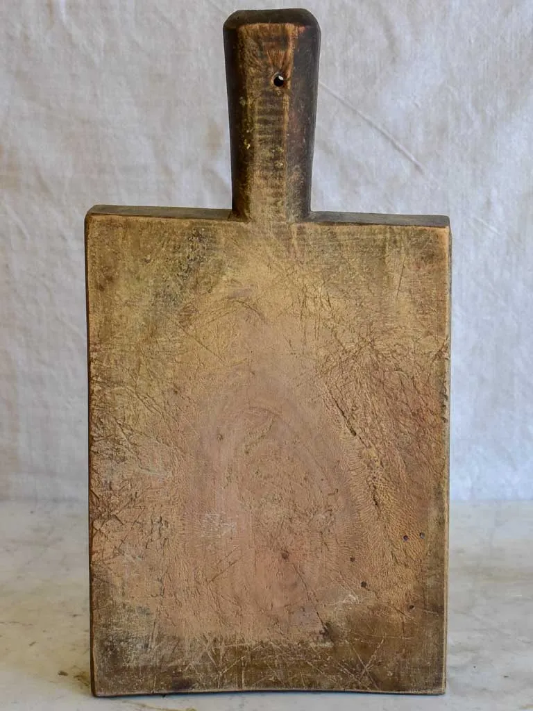 Very chunky antique French cutting board with rectangular handle 8¾" x 16¼"